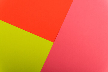 top view of colorful abstract red, green and pink paper background