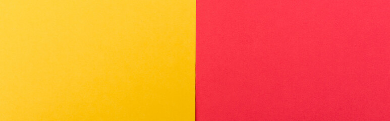Obraz premium top view of colorful abstract yellow, red paper background, panoramic shot