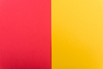 top view of colorful abstract yellow, red paper background