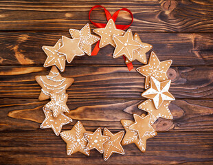 Top view of tasty homemade cookies on wooden table. Holiday wreath