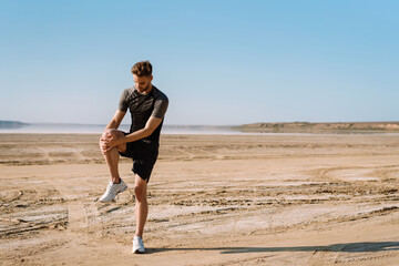 Motivated focused young sportsman exercising