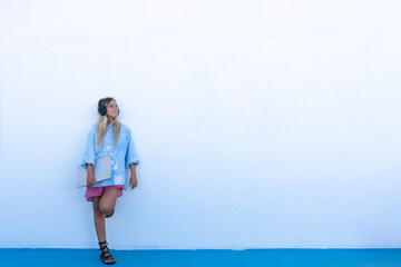 woman listening to music relaxed on the wall