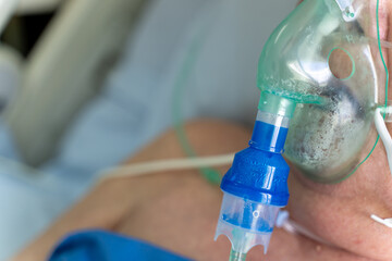 A old man patient in the hospital with oxygen mask