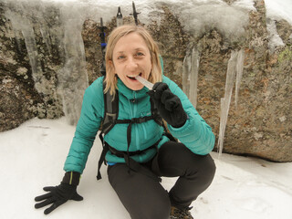 BLONDE WOMAN WITH AN ICE BUFFER IN HER MOUTH
