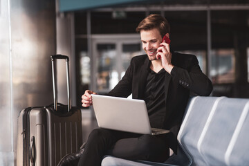 Man dealing with his working tasks in the airport