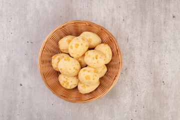 Typical brazilian cheese buns in a basket, top view