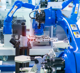 robot gripping and smart robot working on smart factory,industry 4.0 and technology.