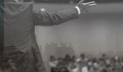 Audience watching a presentation. Presenter on stage giving talk to crowd of people. Speaker at investor pitch conference. 
Defocused blurred presenter during conference lecture event. Seminar photo.