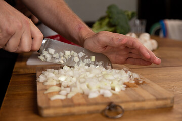 Obraz na płótnie Canvas Hands chopping and preparing vegetables. 