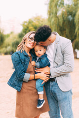 A portrait of a young little family having a great time together