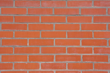 Obraz premium Red brick wall on a sunny day.