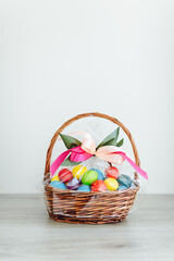 Easter color eggs in festive gift basket
