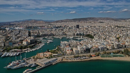 Aerial drone panoramic photo of iconic round port and marina of Zea in the heart of Piraeus with beautiful sky and clouds, Attica, Greece