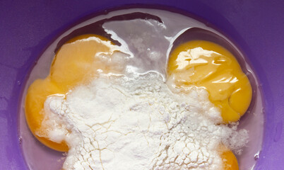 Yolk with squirrel chicken egg with sugar in violet guard;keep