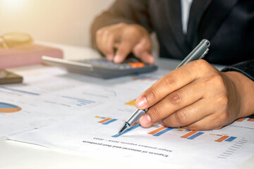 Business people reviewing reports, financial documents for analysis of financial information, work concept.