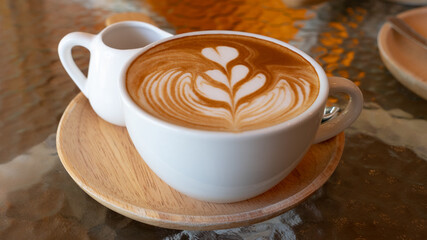 closeup cup of coffee latte art in coffee shop