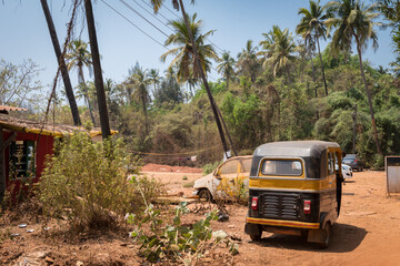 Parking of taxi cars near the village in India