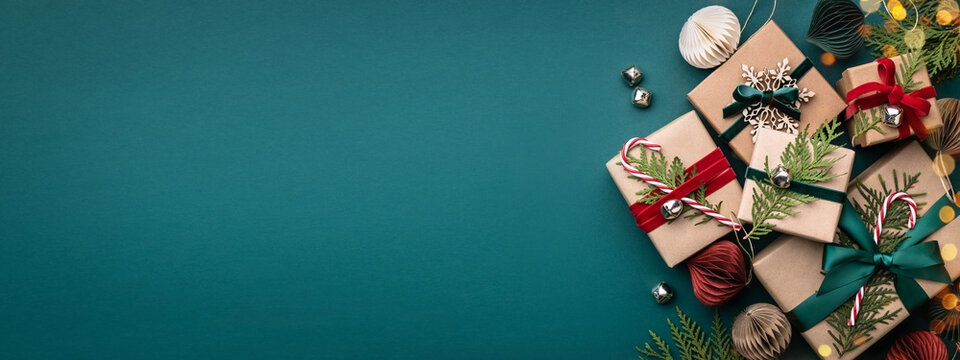 Banner with many gift boxes tied velvet ribbons and paper decorations on turquoise background. Christmas background.
