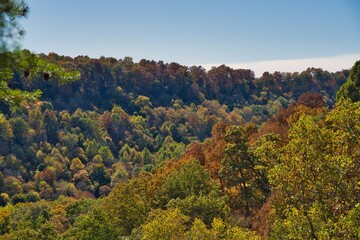 Valley during fall in buzzard roost chillicothe. Colorful trees on hillside of apalachian foothills. Orange, red, and yellow leaves on trees