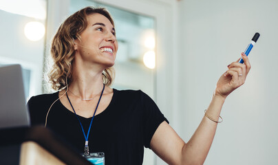 Smiling business woman giving a presentation
