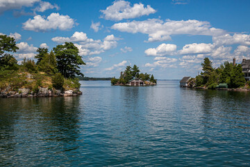 Thousand islands with their cottages along the St Lawrence river and US Canada border