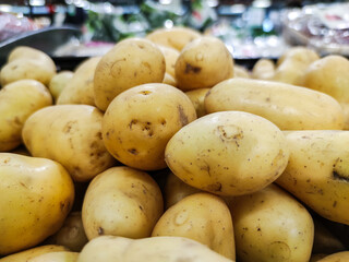 Selected focus on Group of potatos sold on a market