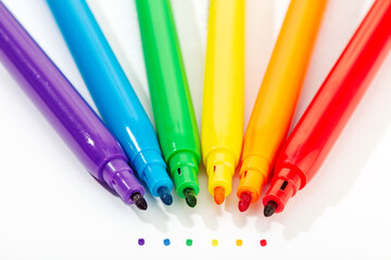 Markers of rainbow colors isolated on white background