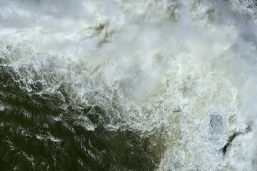 A powerful water eddy created by an open dam sluice