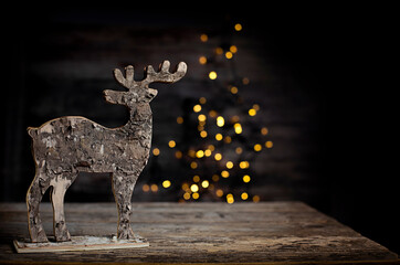 blurred background of xmas tree and reindeer