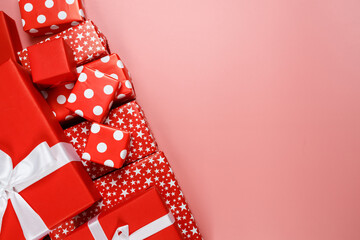Obraz premium Frame of red gift boxes on pink background with copy space for text 11.11 single's day sale.