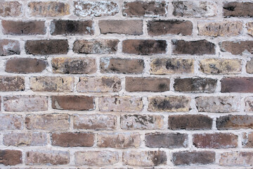 Background of wide old brick wall texture. Home or office design backdrop. Close-up texture. 