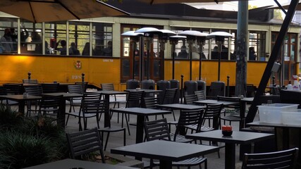 Italy , Milan October 2020 - Corso Sempione - Empty tables, closed pubs, restaurants, bars and venues due to coronavirus, covid-19 outbreak. Al businesses with public are temporary closed