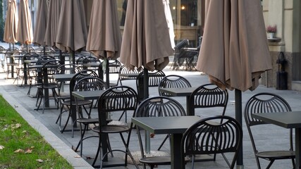 Italy , Milan October 2020 - Corso Sempione - Empty tables, closed pubs, restaurants, bars and venues due to coronavirus, covid-19 outbreak. Al businesses with public are temporary closed