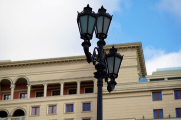 Fototapeta na wymiar old styled street lamp in Moscow by blue sky