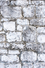 Background of wide old. different brick or stone wall texture. Home or office design backdrop