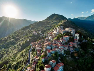 Poster An aerial view at sunset of the town of Triora in Liguria, Italy. © ottaviocamb