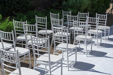 White wooden chairs.