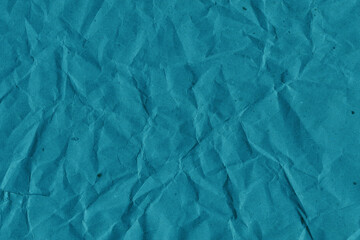 Obraz premium Blue vintage and old looking crumpled paper background. Retro cardboard texture. Grunge paper for drawing. Ancient book page. Present wrapping.