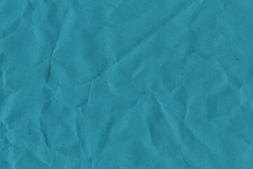 Obraz premium Blue vintage and old looking crumpled paper background. Retro cardboard texture. Grunge paper for drawing. Ancient book page. Present wrapping.