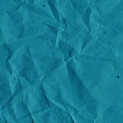 Blue vintage and old looking crumpled paper background. Retro cardboard texture. Grunge paper for drawing. Ancient book page. Present wrapping.
