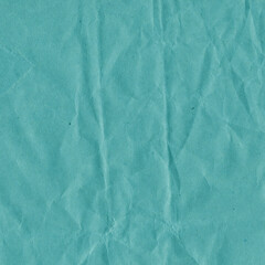Blue vintage and old looking crumpled paper background. Retro cardboard texture. Grunge paper for drawing. Ancient book page. Present wrapping.