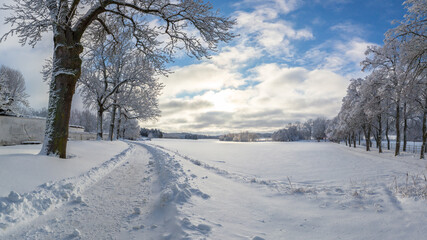 Obraz premium Rural road in a snow covered winter wonderland