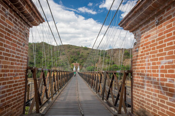 Obraz premium Santa Fe de Antioquia / Colombia - January 21, 2018. Puente de Occidente (Western Bridge) in Santa Fe de Antioquia, Colombia