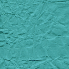 Blue vintage and old looking crumpled paper background. Retro cardboard texture. Grunge paper for drawing. Ancient book page. Present wrapping.