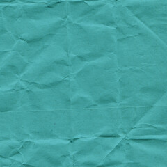 Blue vintage and old looking crumpled paper background. Retro cardboard texture. Grunge paper for drawing. Ancient book page. Present wrapping.