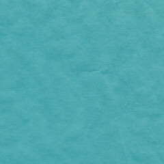 Blue vintage and old looking crumpled paper background. Retro cardboard texture. Grunge paper for drawing. Ancient book page. Present wrapping.