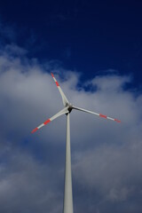 wind turbine against sky - 386458914