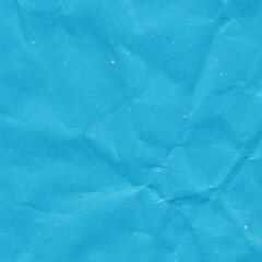Blue vintage and old looking crumpled paper background. Retro cardboard texture. Grunge paper for drawing. Ancient book page. Present wrapping.