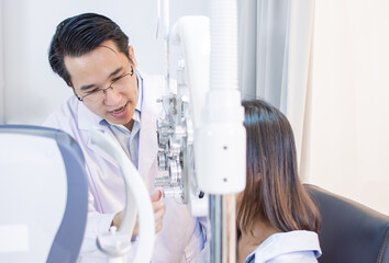 Ophthalmologist doing eyes test  for a woman