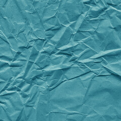 Obraz premium Blue vintage and old looking crumpled paper background. Retro cardboard texture. Grunge paper for drawing. Ancient book page. Present wrapping.